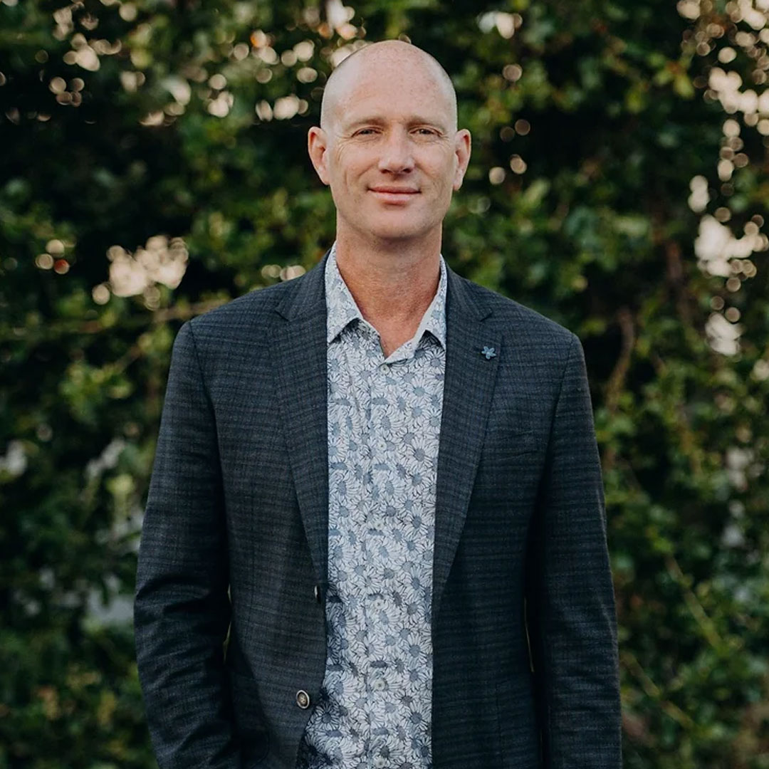 Biotechnologist and founder of SRW Laboratories Greg Macpherson standing in front of greenergy